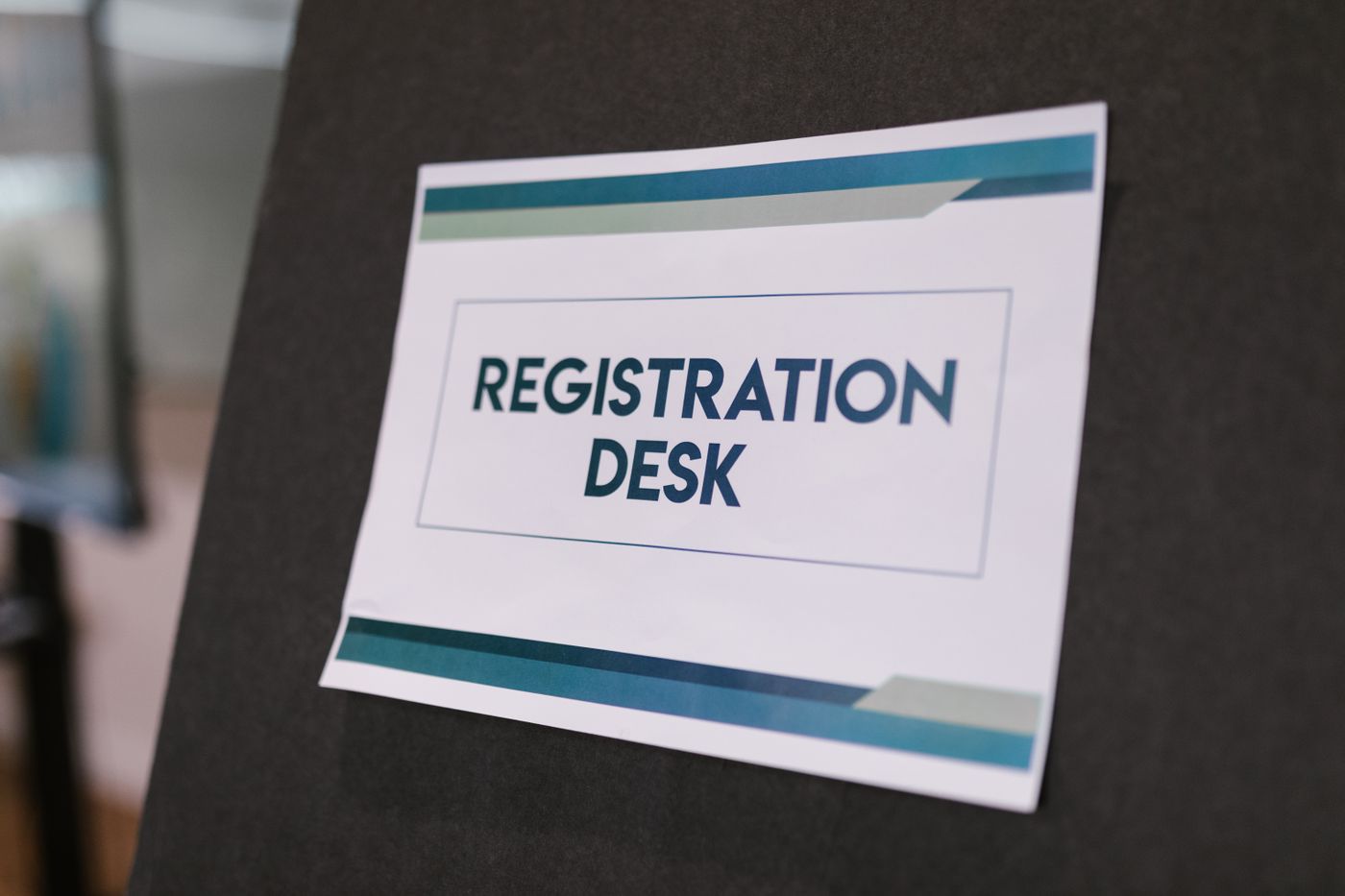 Registration and ticketing desk staff at event check-in